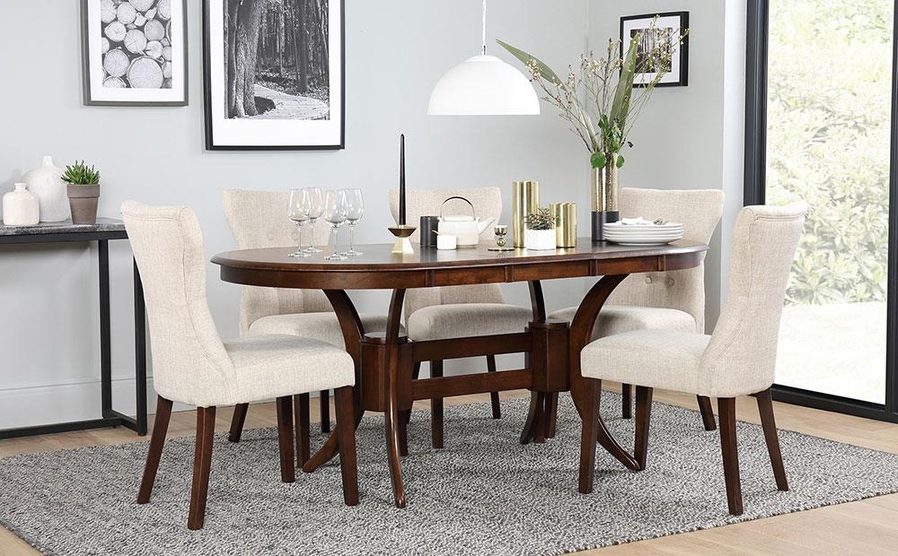 Dark Wood Extending Dining Tables With Most Current Townhouse Oval Dark Wood Extending Dining Table And 6 Chairs Set (View 4 of 20)