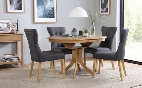 Extended Dining Tables And Chairs Pertaining To Preferred Hudson Round Oak Extending Dining Table With 6 Oxford Ivory Chairs (View 8 of 20)