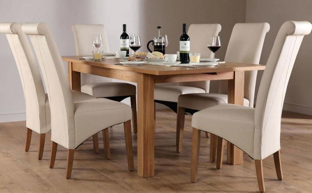 Light oak dining table and chairs