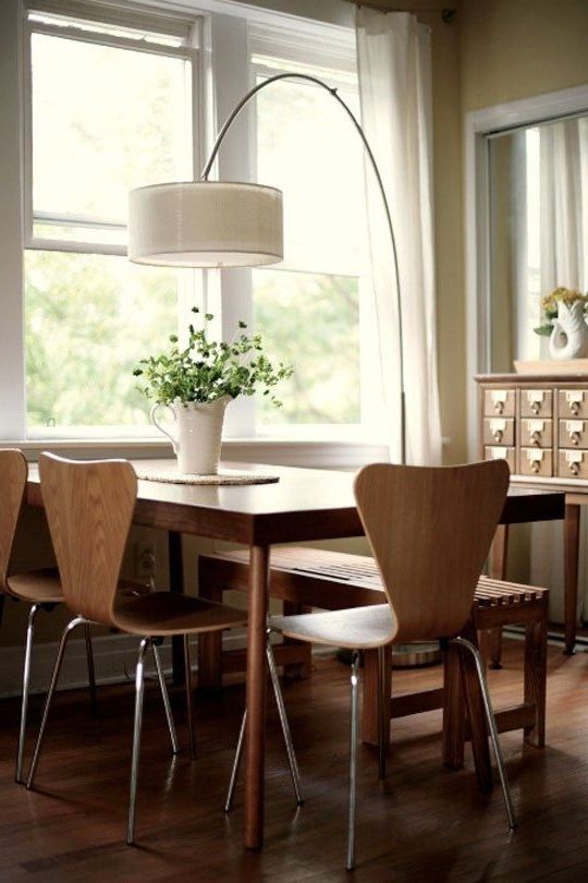 Lighting For Dining Tables For Recent An Arc Lamp Illuminates The Dining Table (View 9 of 20)