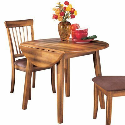 Ashley Berringer 42" Round Drop Leaf Dining Table In With Most Current Rustic Honey Dining Tables (View 8 of 10)