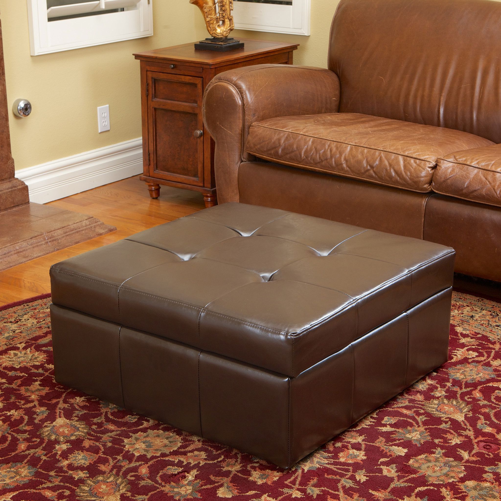 Brown Fabric Tufted Surfboard Ottomans Throughout 2018 Westridge Brown Leather Storage Ottoman (View 10 of 10)