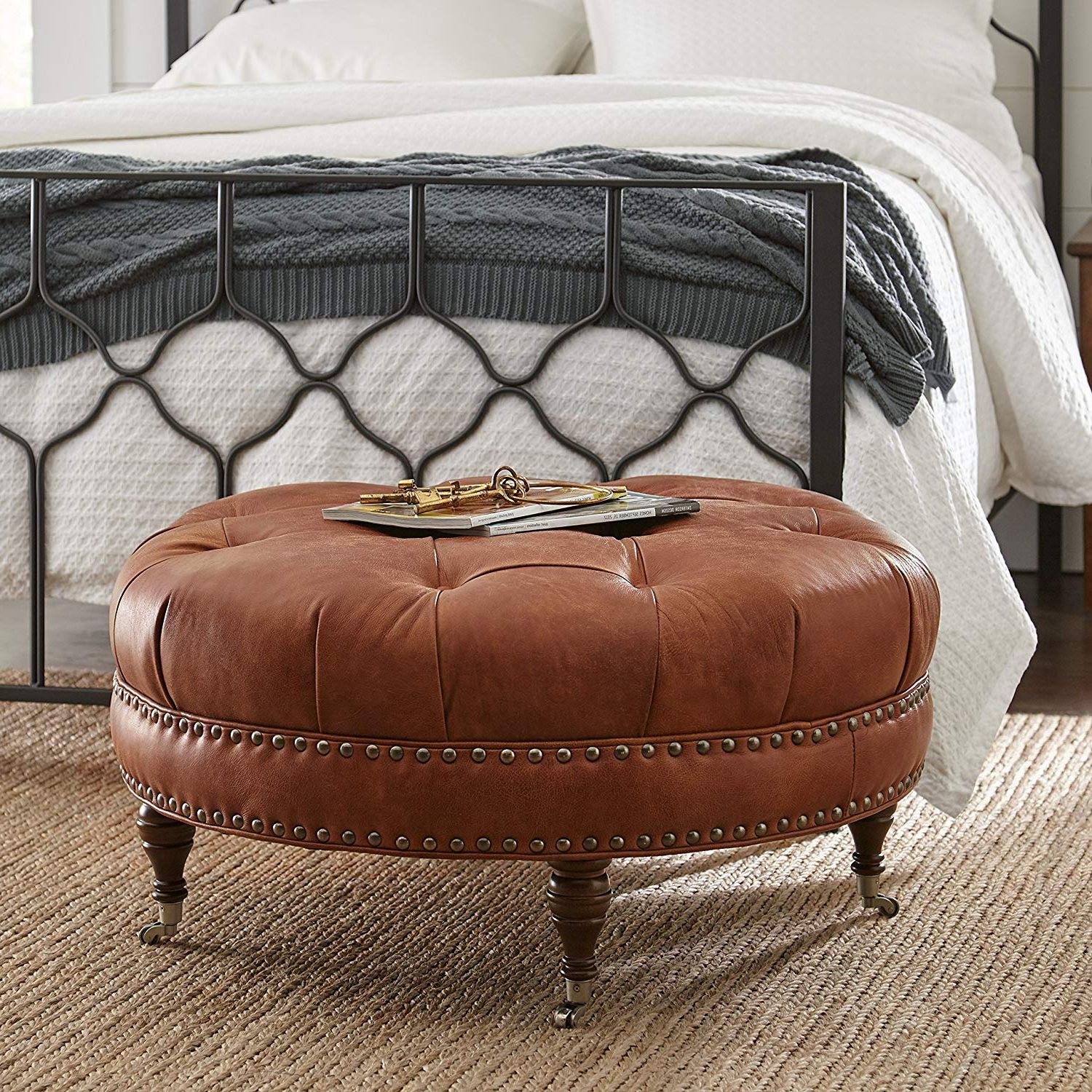 Button Tufted Round Leather Wheeled Ottoman With Spindled Wooden Legs Inside Latest Tufted Ottomans (View 1 of 10)