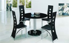 20 Collection of Round Black Glass Dining Tables and 4 Chairs